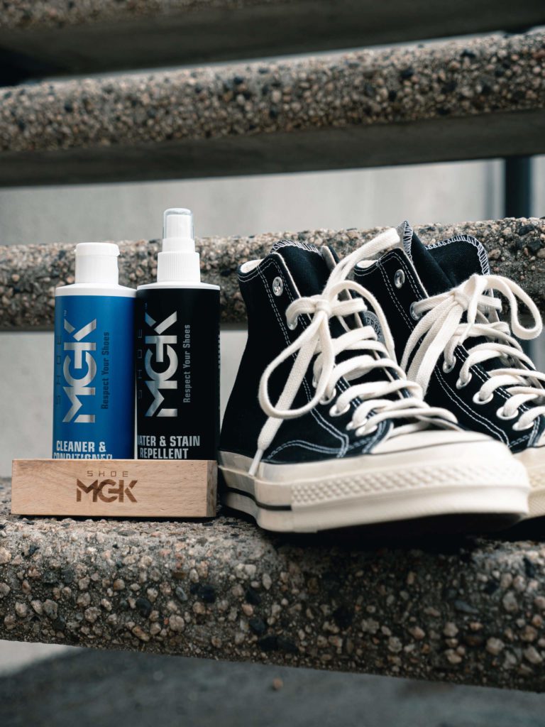 The Shoe MGK Clean and Protect Kit next to Converse shoes