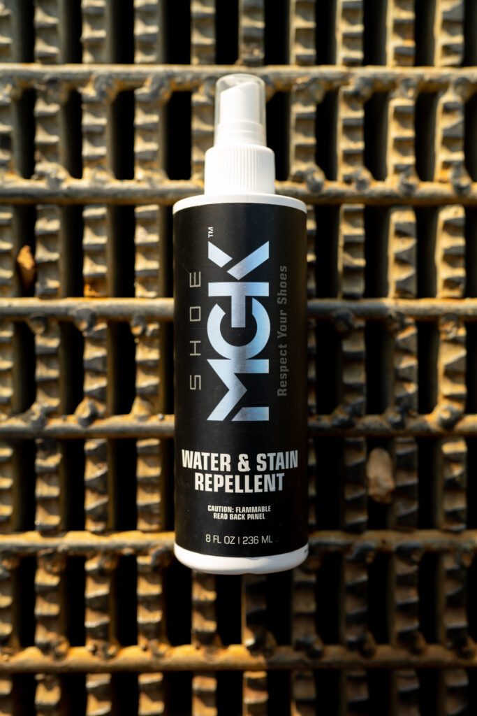 A bottle of the Shoe MGK Water and Stain Repellent