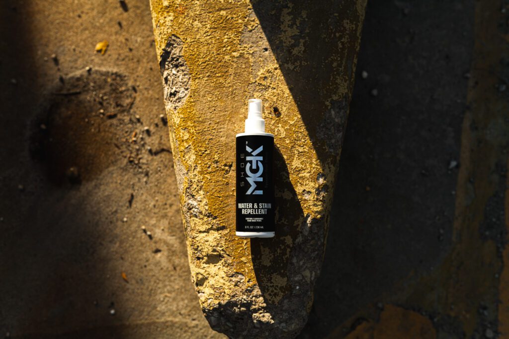 A bottle of the Shoe MGK Water and Stain Repellent