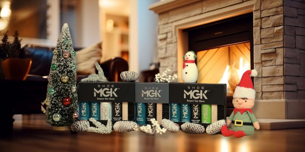 Shoe MGK products next to a Christmas tree by a fireplace