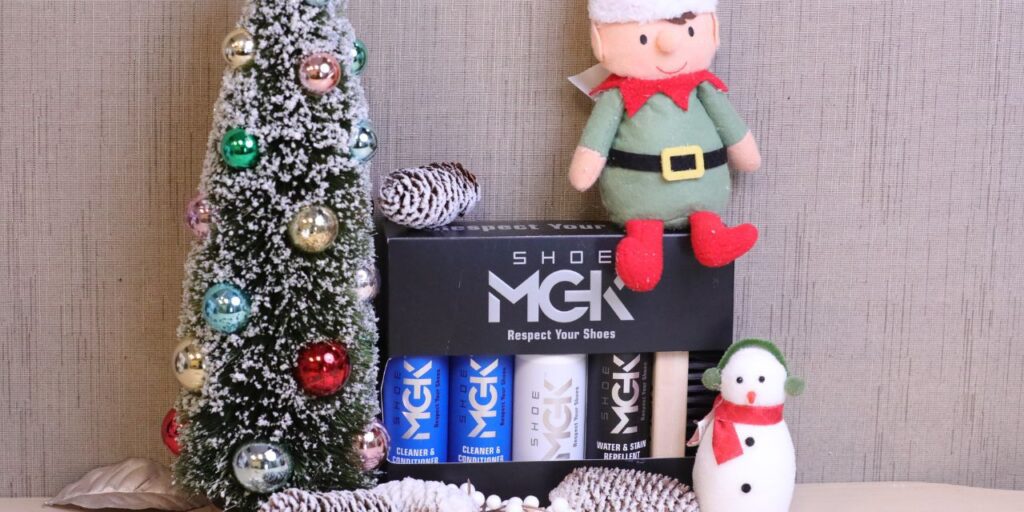 Elf sitting on the Shoe MGK MVP Kit next to a Christmas tree