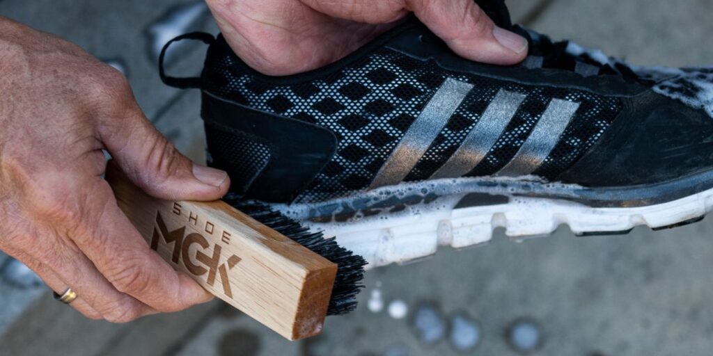 Man cleans Adidas running shoes with Shoe MGK