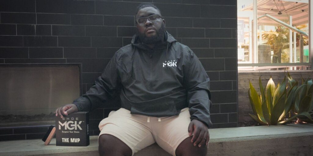 Man sits on a bench with shoe cleaner