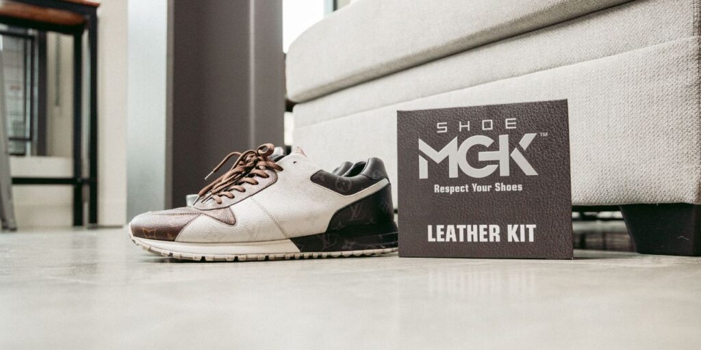 Leather shoes next to the Shoe MGK Leather Care Kit