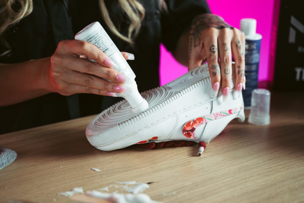 Woman restores shoes with the Shoe MGK White Touch-Up