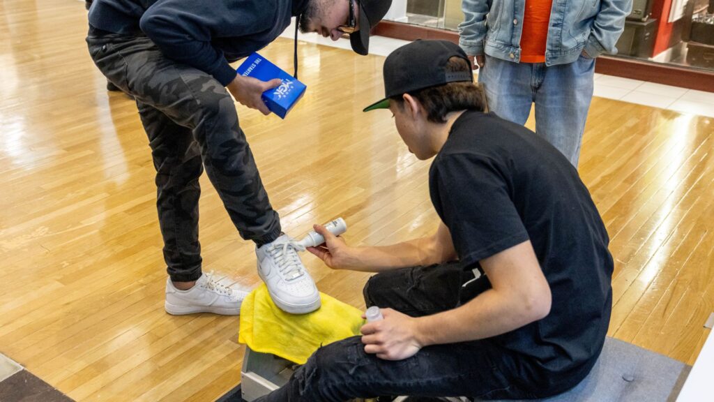 Man restores shoes with the Shoe MGK White Touch-Up