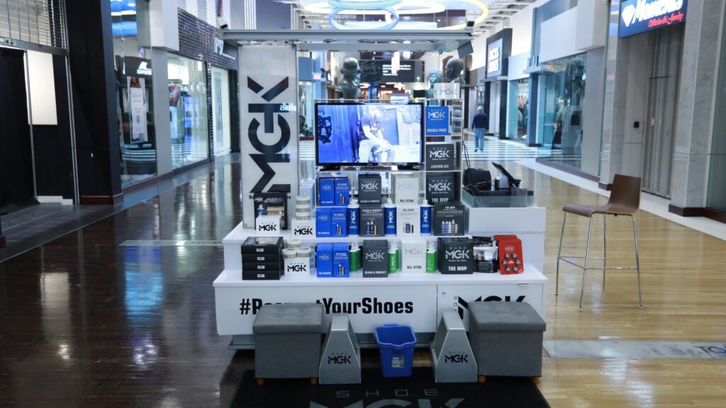 A Shoe MGK Cart in the middle of a mall