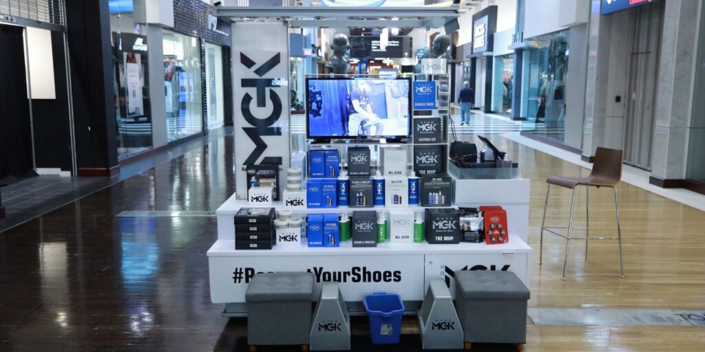 Shoe MGK products on a mall cart.