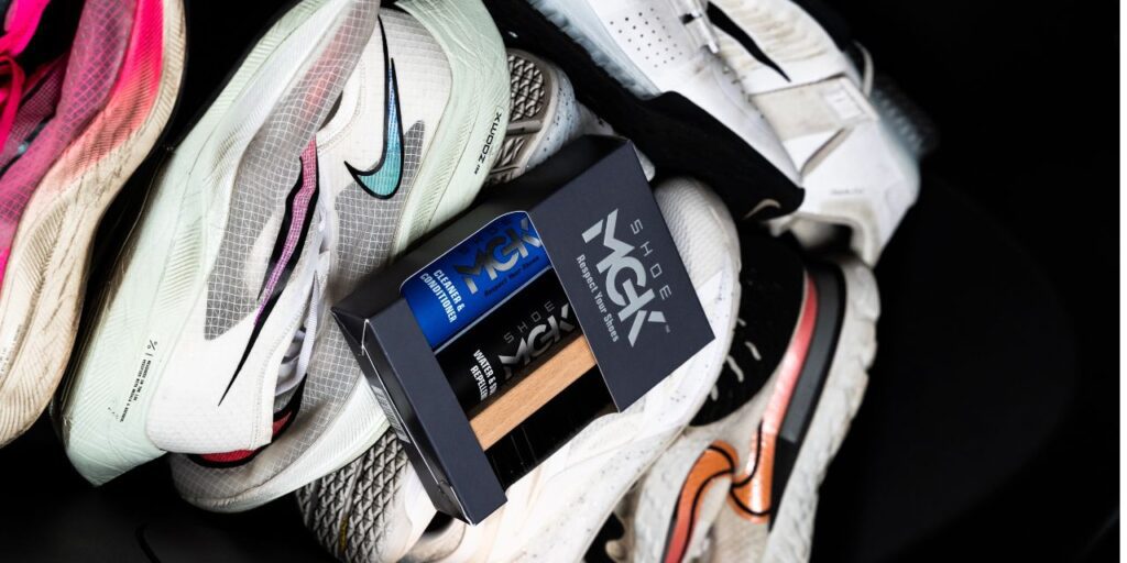 Shoe Cleaner on top of multiple pairs of running shoes