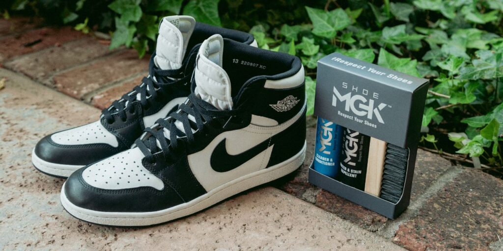 Athletic shoes next to the Shoe MGK Clean & Protect Kit