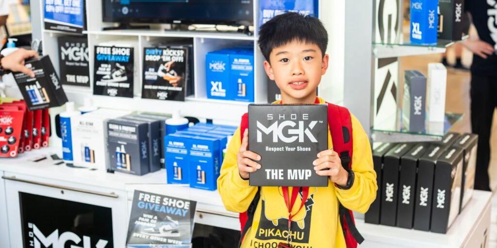 A kid holding the Shoe MGK MVP Kit