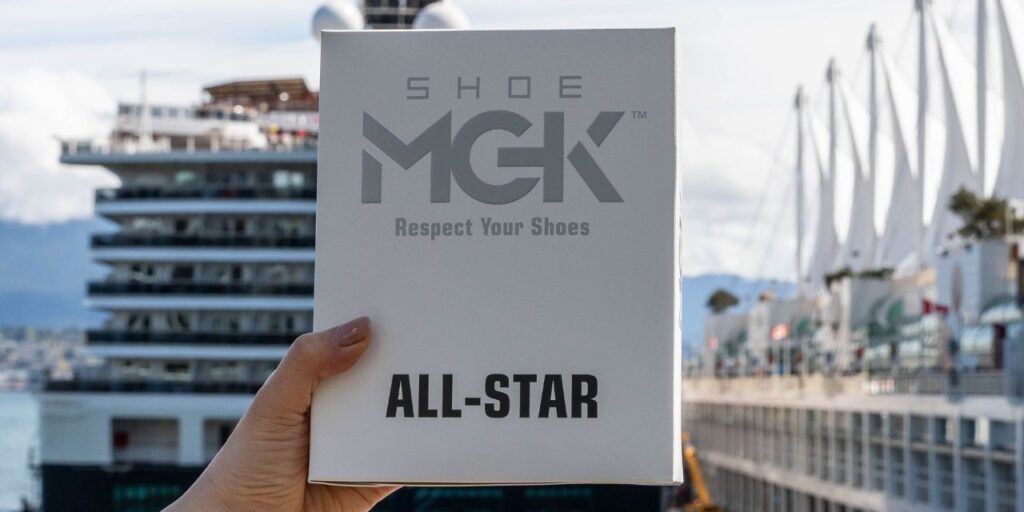 Woman holding the Shoe MGK All-Star Kit