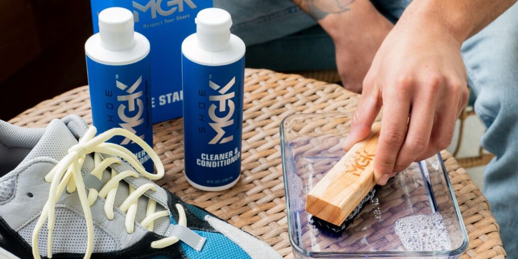 Man cleans shoes with Shoe MGK