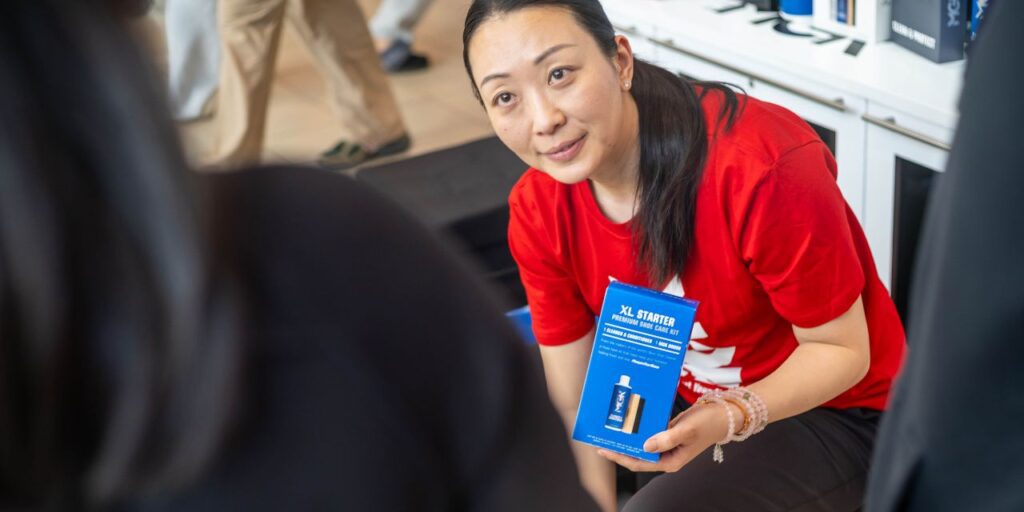 Woman holding the Shoe MGK Starter Kit XL for the New Year